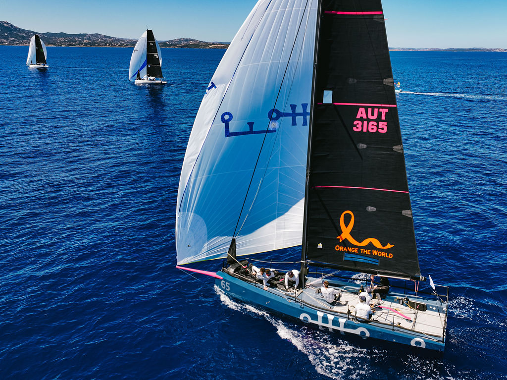 Aerial view of a Cape 31 heeled under spinnaker