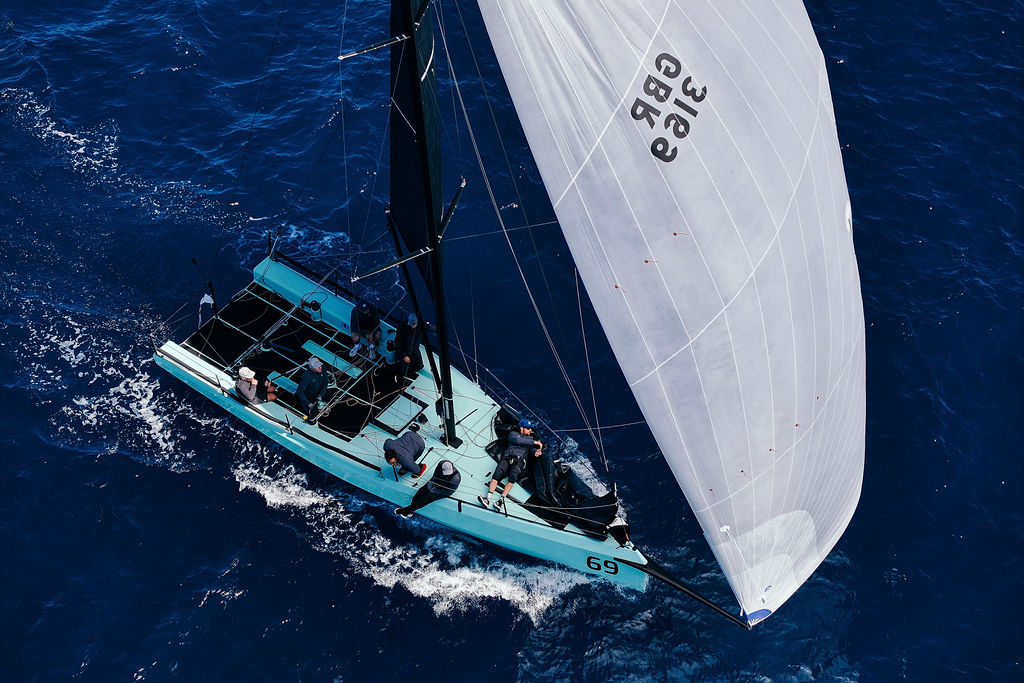 Cape 31 seen from above under spinnaker, mast and spreaders visible